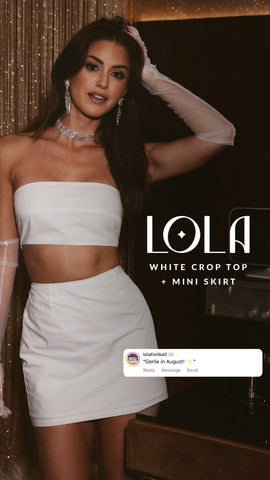 Model in the Lola white strapless crop top and matching mini skirt set.