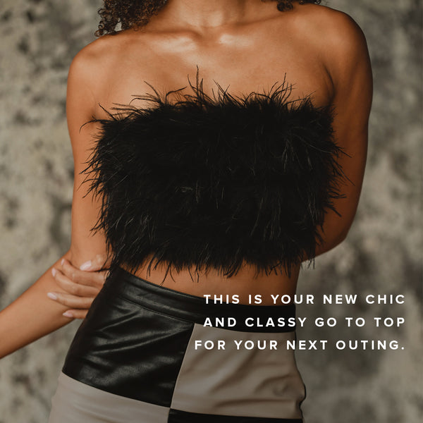 Black feather strapless top with two-tone leather skirt, a chic festival outfit for women.