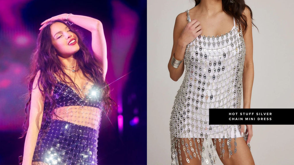 Performer on stage in sparkles next to model in a silver chain festival mini dress.
