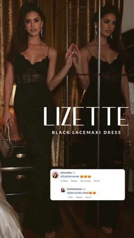Model in the Lizette black lace maxi dress posing beside a mirror.