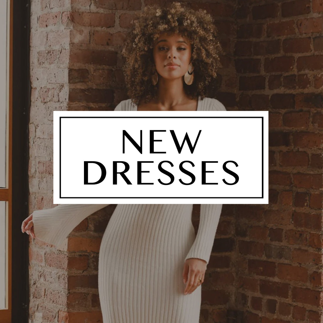 New Dresses blog cover: woman in a white ribbed knit maxi dress against exposed brick.