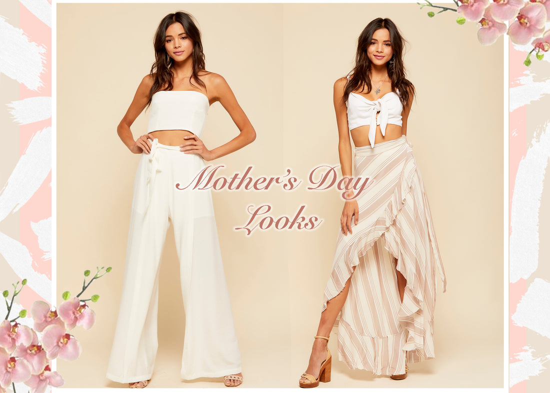 Two women in white and striped boho outfits for Mother's Day, with pink orchids.