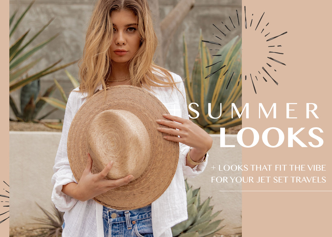 Woman in white linen shirt and jeans holding a straw sun hat among desert agave plants.